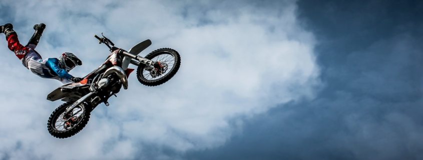 Motocross racek doing extreme jump